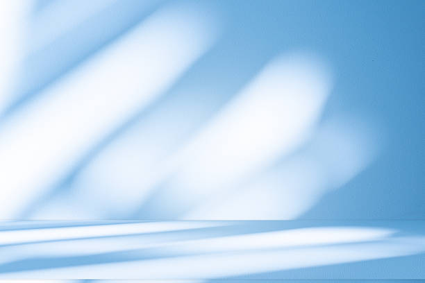 istock Studio style background wall decoration presentation uses white and blue tones. with shadows cast from a nearby window, concept creating a decorative 2216372712