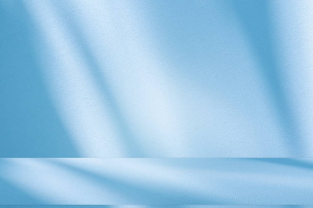 istock Studio style background wall decoration presentation uses white and blue tones. with shadows cast from a nearby window, concept creating a decorative 2216372766