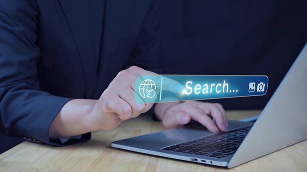 istock SEO, Search Engine Optimization and Web Search Interface Concept. Woman pointing at search bar and holding smartphone, representing online search, SEO, web visibility strategies 2216373962