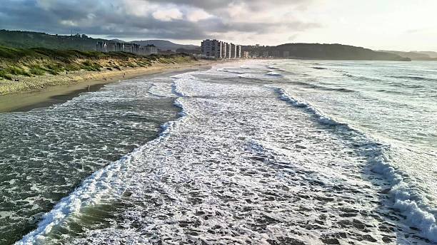 istock Experience the stunning coastal waves accompanied by a beautiful scenic background at sunset 2216377004