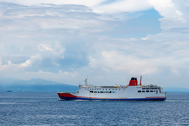 istock Passenger ferry sailing across calm blue sea under a partly cloudy sky 2216382169