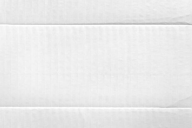 istock White paper background of packaging cardboard with fold lines 2216382553
