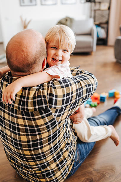 istock Feeling happy and safe in daddy's hug 2216390129