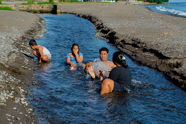 istock Beach creek exploration during family day out 2216390663