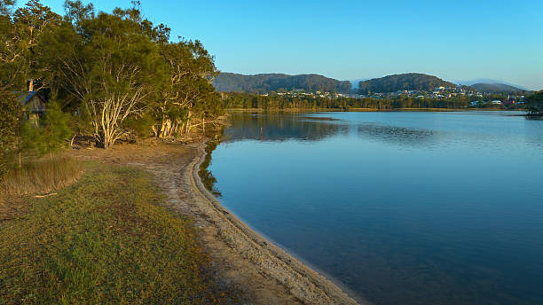 istock serene-lake-shoreline-natural-landscape-view 2216390741