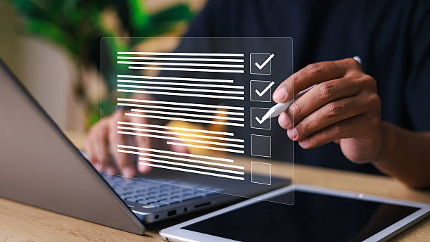 istock Checklist and clipboard task documentation management. Online survey online exam Choosing the right answer in the exam. 2216390854
