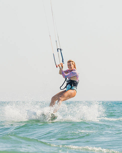 istock Young Woman Kitesurfing 2216391111