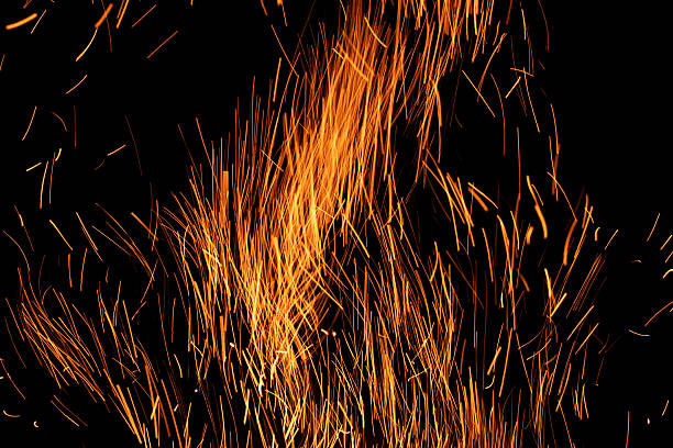 sparks from the fire glowing in the dark
