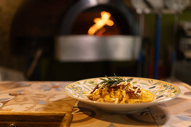 Close-up shot of freshly prepared pasta in restaurant kitchen without people