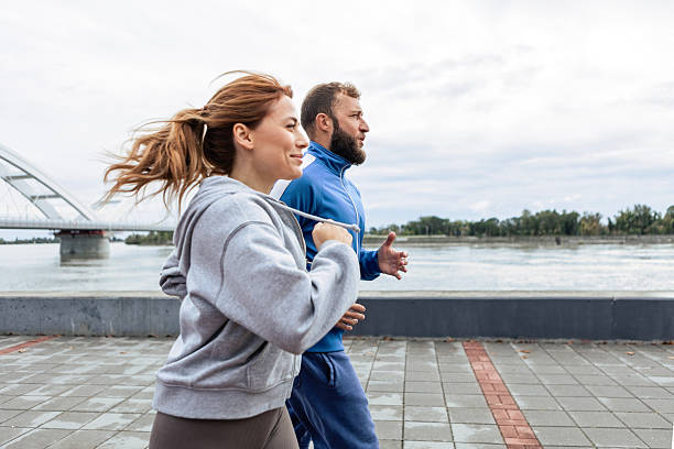 istock Young Couple Exercising Outdoors 2216395543