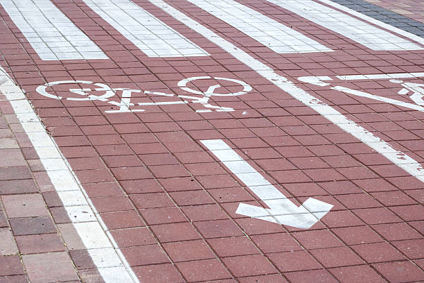 istock The bicycle lane features a white arrow indicating the direction to the right 2216396785