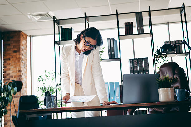 istock Professional businesswoman working in a stylish office setting during a productive workday 2216397353
