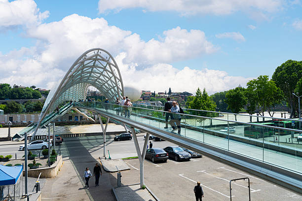 Tbilisi, Georgia. May 17, 2025. panoramic view of the Peace Bridge over the Kura River in the city center