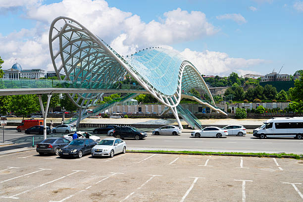 Tbilisi, Georgia. May 17, 2025. panoramic view of the Peace Bridge over the Kura River in the city center