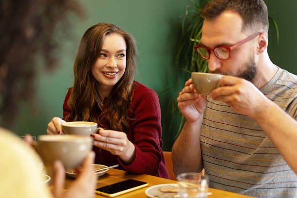istock Friends enjoying coffee and conversation at a cafe 2216401172