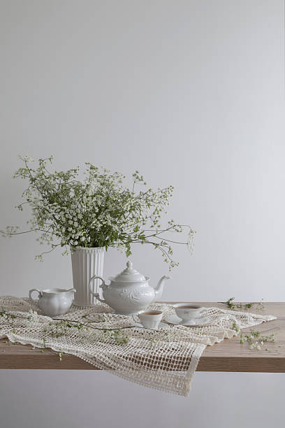 istock vintage still with tea and  wildflowers in white interior 2216403699