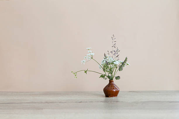 istock still life with wildflowers  in ceramic vase on wooden table 2216403776