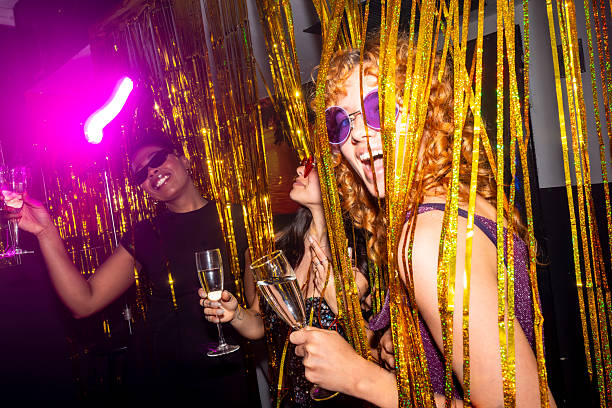 istock Young women having fun at a sparkling party 2216403821