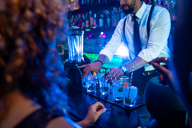 istock Bartender preparing cocktails in a nightclub 2216403883