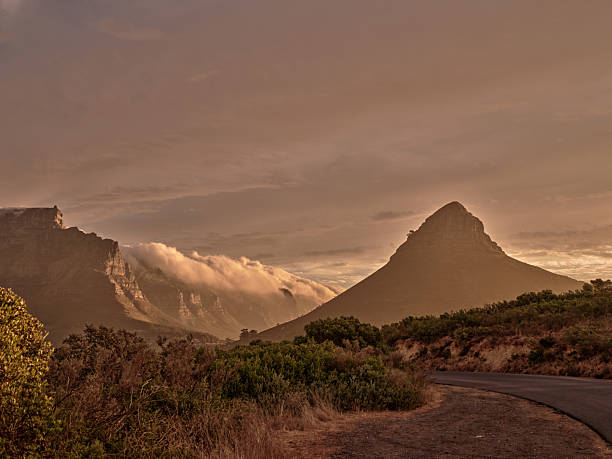 istock Majestic Mountain Landscape at Sunset with Soft Clouds and Rustic Road 2216404671