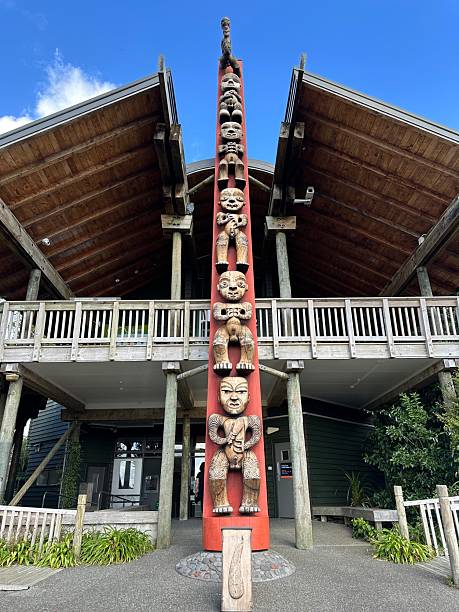 WAITANGI, NZL - FEB 06 2025:Traditional Maori face wooden carving at Te Whare Rūnanga (Carved Maori Meeting House) in Waitangi treaty grounds in Northland, New Zealand.The building often symbolises an ancestor of the local Maori tribe