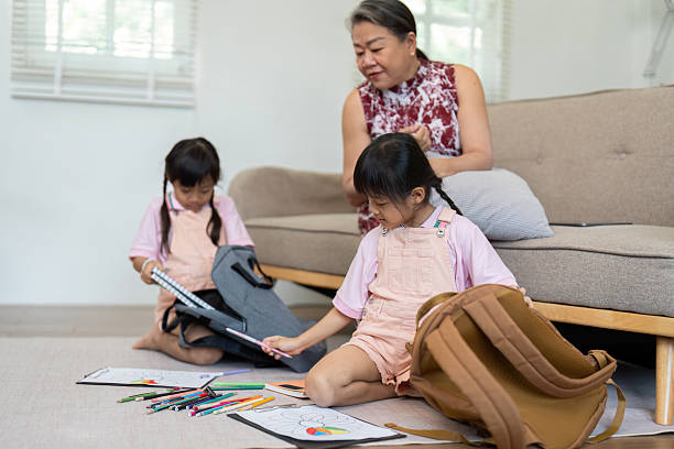 istock Creative Learning and Play. Two girls exploring art supplies while preparing for school. 2216405620