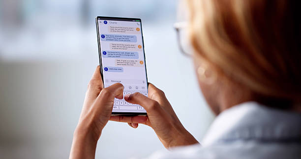 istock Young African American Woman Using Smartphone To Send Text Messages 2216405874
