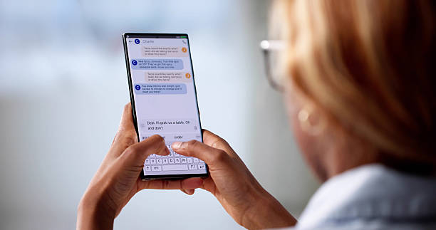 istock Woman Holding Smartphone Sends Text Message On Phone 2216405884