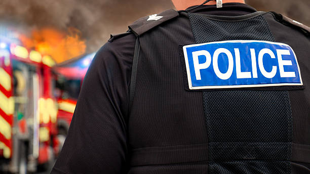 istock Police force and firefighters at major fire 2216406497