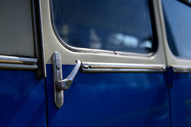 istock Metal handle on a blue car door 2216407341