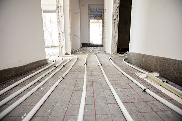 istock Pipe system of floor heating mounted in residential building under construction 2216407890