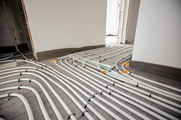 istock Pipe system of floor heating mounted in residential building under construction 2216407891