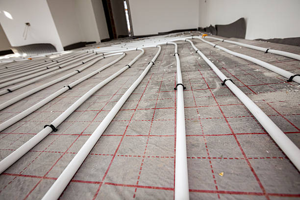 istock Pipe system of floor heating mounted in residential building under construction 2216408095