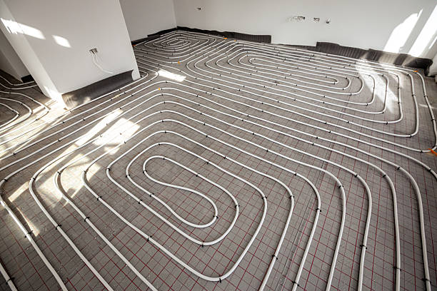 istock Pipe system of floor heating mounted in residential building under construction 2216408345