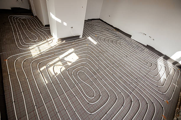 istock Pipe system of floor heating mounted in residential building under construction 2216408347