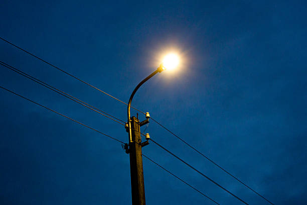 Lamppost at night. Light from an electric pole, lantern.