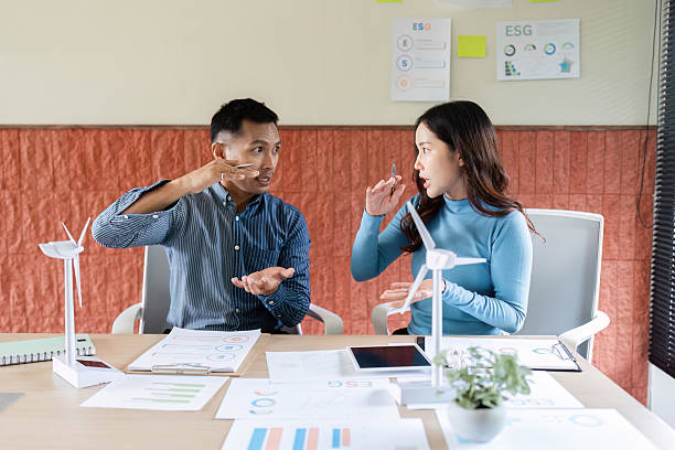 istock ESG Collaboration. Professionals brainstorming on renewable energy solutions in a modern office. 2216412258