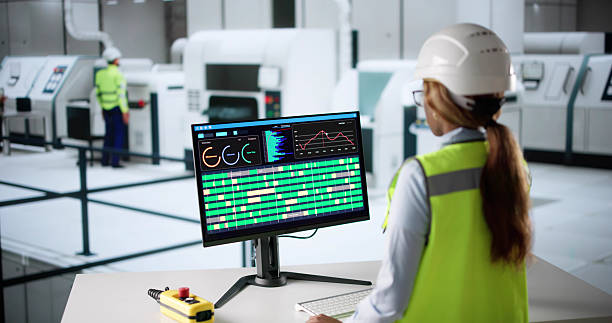 istock African American Woman Controls Automated SCADA Process 2216412699