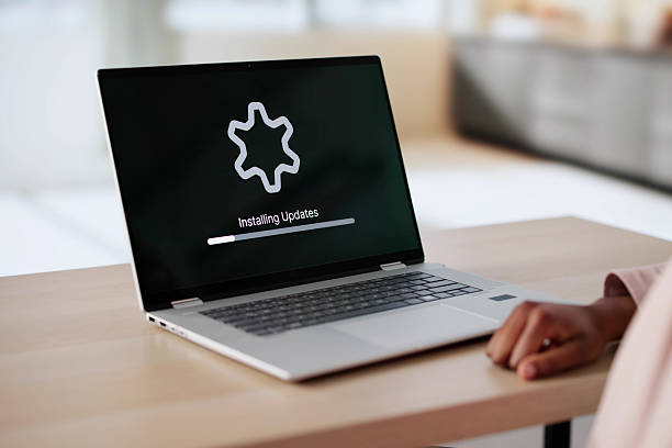 istock African Woman Updating Laptop Software 2216412740