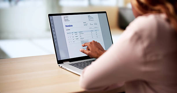 istock Woman Managing Finances With E-invoice Tax Software 2216412761
