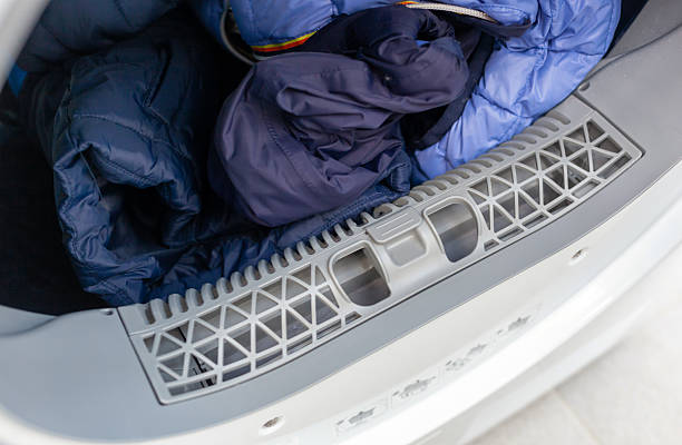 istock Clothes dryer full of laundry drying after washing 2216415085