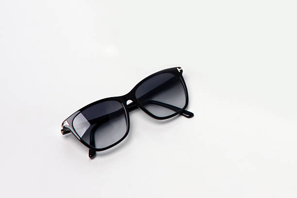 istock Summer black glasses with gradient lenses on white background 2216416010