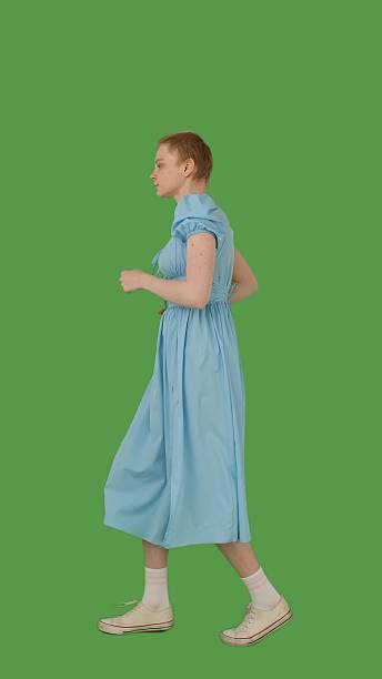istock Jogging in a Blue Dress on Outfit Green Screen 2216417713