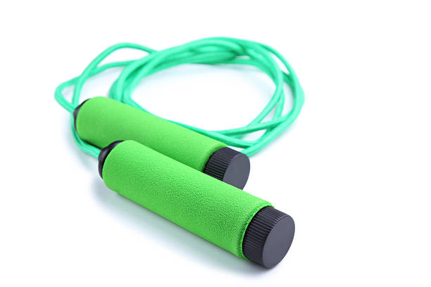Green skipping rope isolated on a white background