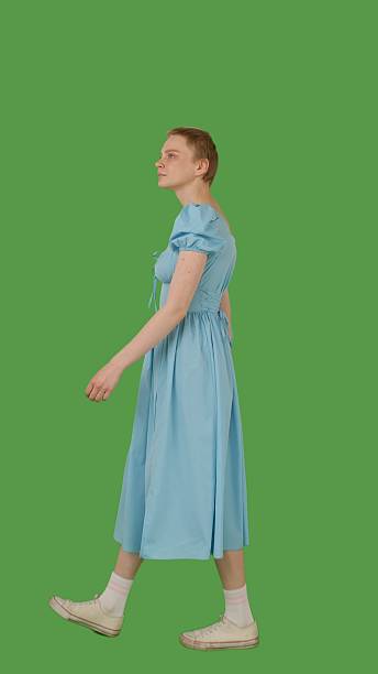 istock Walking in a Blue Dress on Outfit Green Screen 2216421324