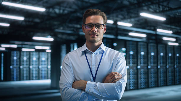 istock Portrait View of Caucasian Software Engineer Standing and Looking at the Camera While Thinking About Solution, Planning Strategy. Programmer Developer and Innovative Startup Concept 2216425388