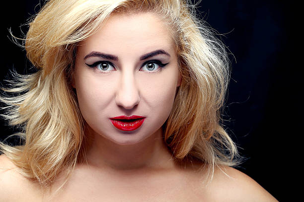 istock Portrait of beautiful model with make-up and red lips 2216428441