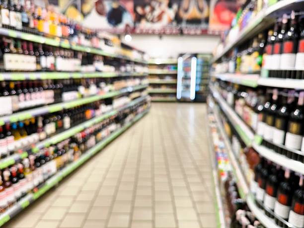 istock blurred supermarket background. alcoholic beverages, alcohol showcase 2216429552