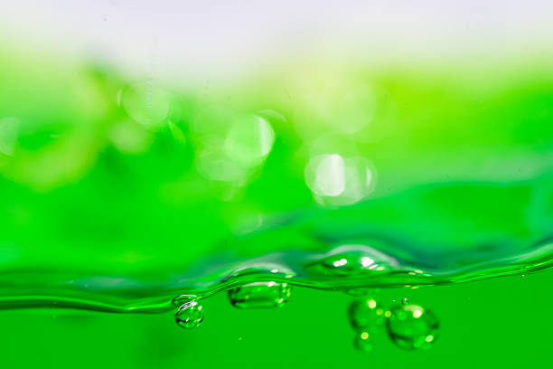 Water wave, close up of vibrant green liquid with bubbles, capturing dynamic movement and freshness. Perfect for backgrounds, beverages, or abstract concepts. soft drink
