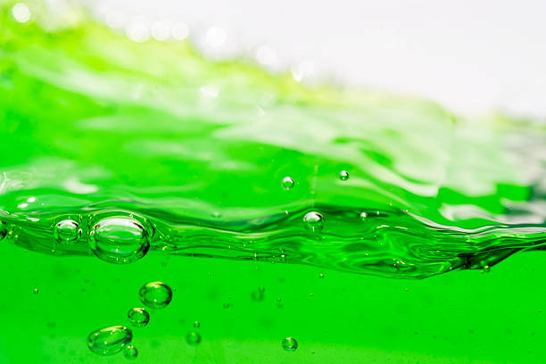 istock Water wave, close up of vibrant green liquid with bubbles, capturing dynamic movement and freshness. Perfect for backgrounds, beverages, or abstract concepts. soft drink 2216469770